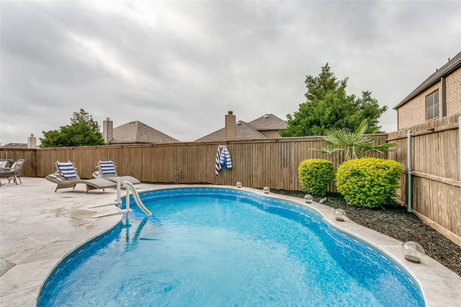 Private backyard pool at 104 Martingale Trl, Oak Point TX