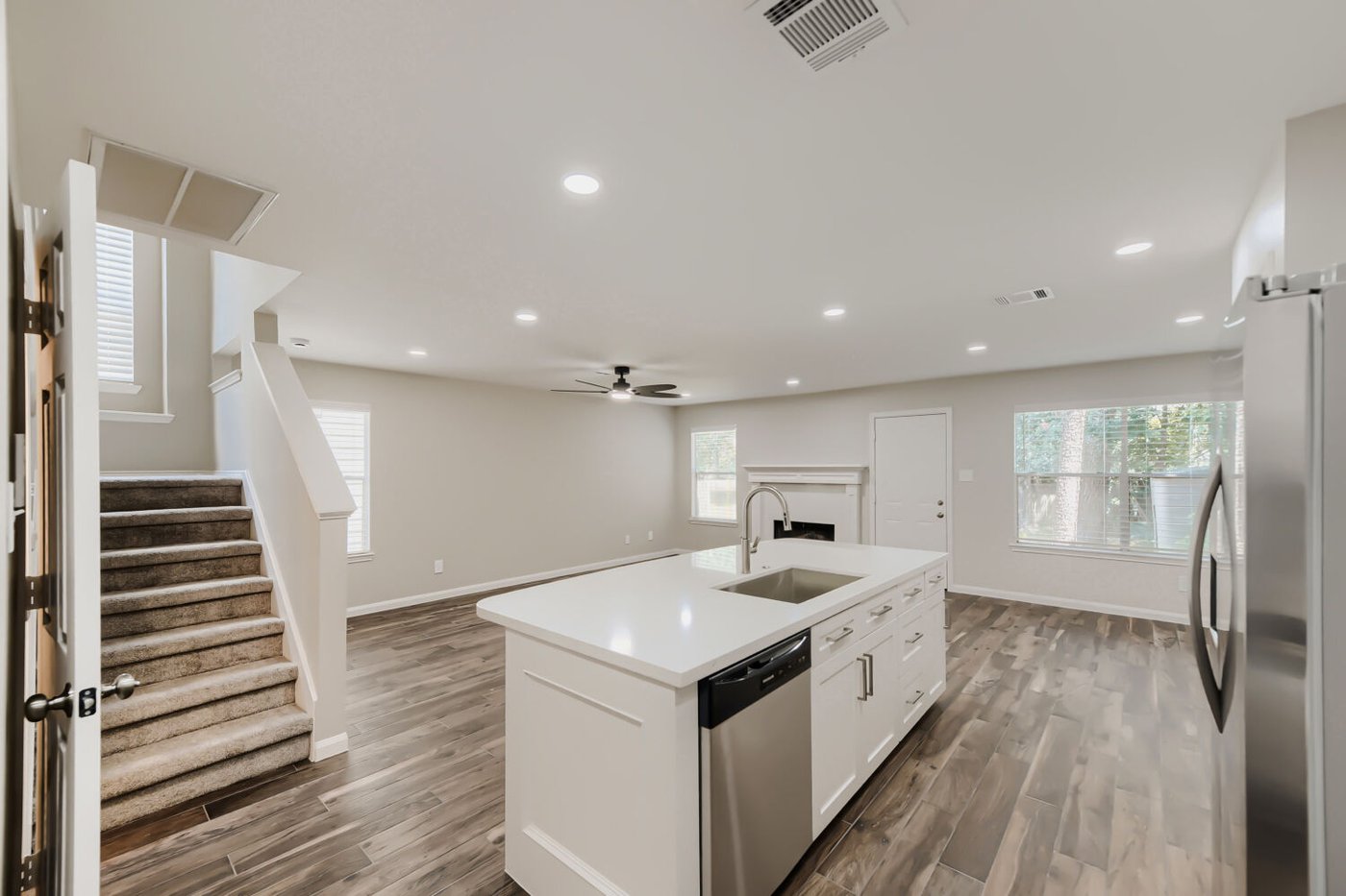 Kitchen with white cabinetry, stainless steel appliances, and pendant lighting at 11 Wineberry Pl