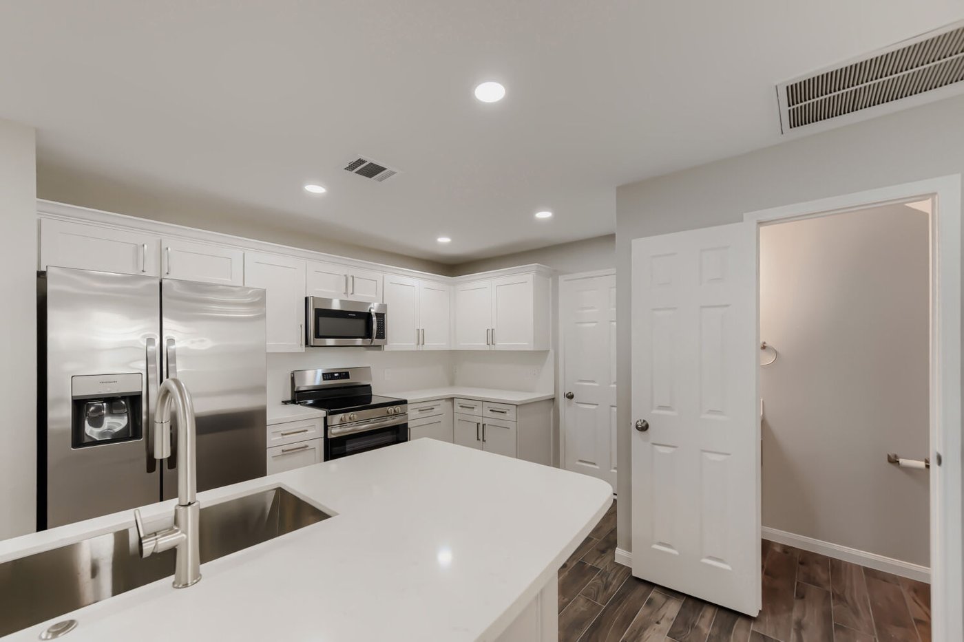 Chef inspired kitchen with a center island and bar seating at 11 Wineberry Pl