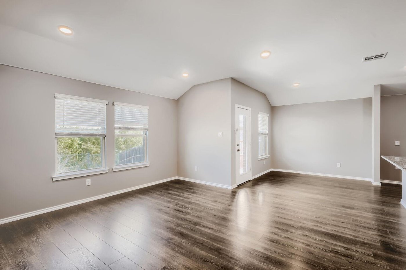 Living room with wood-look laminate flooring at 1212 Rountree Ct, Celina