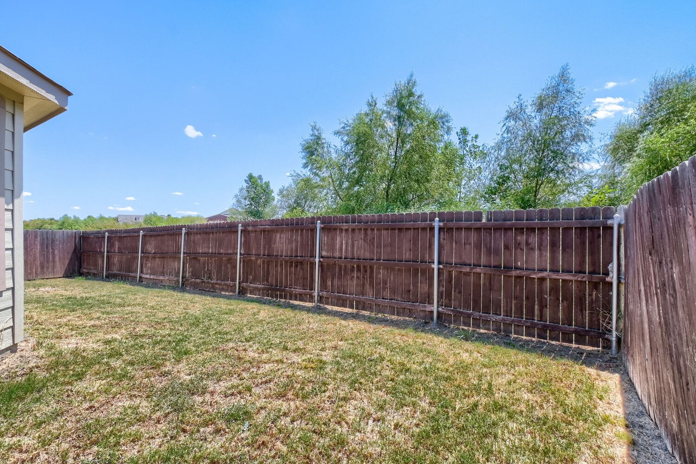 Private fenced backyard at 1309 Fantail Ln, Ennis, TX