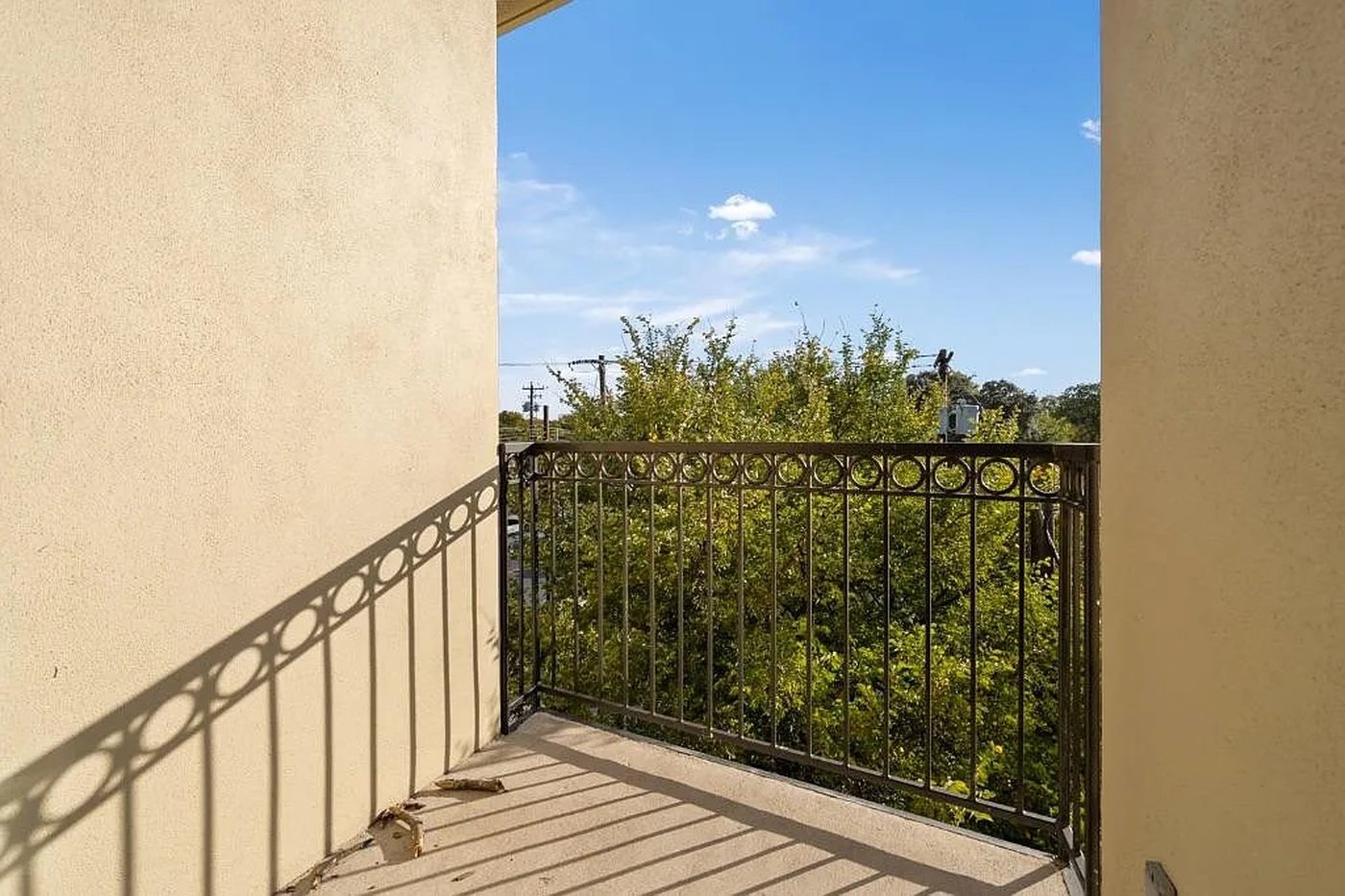 Second balcony with treetop and downtown views at 1310 S 1st St #310