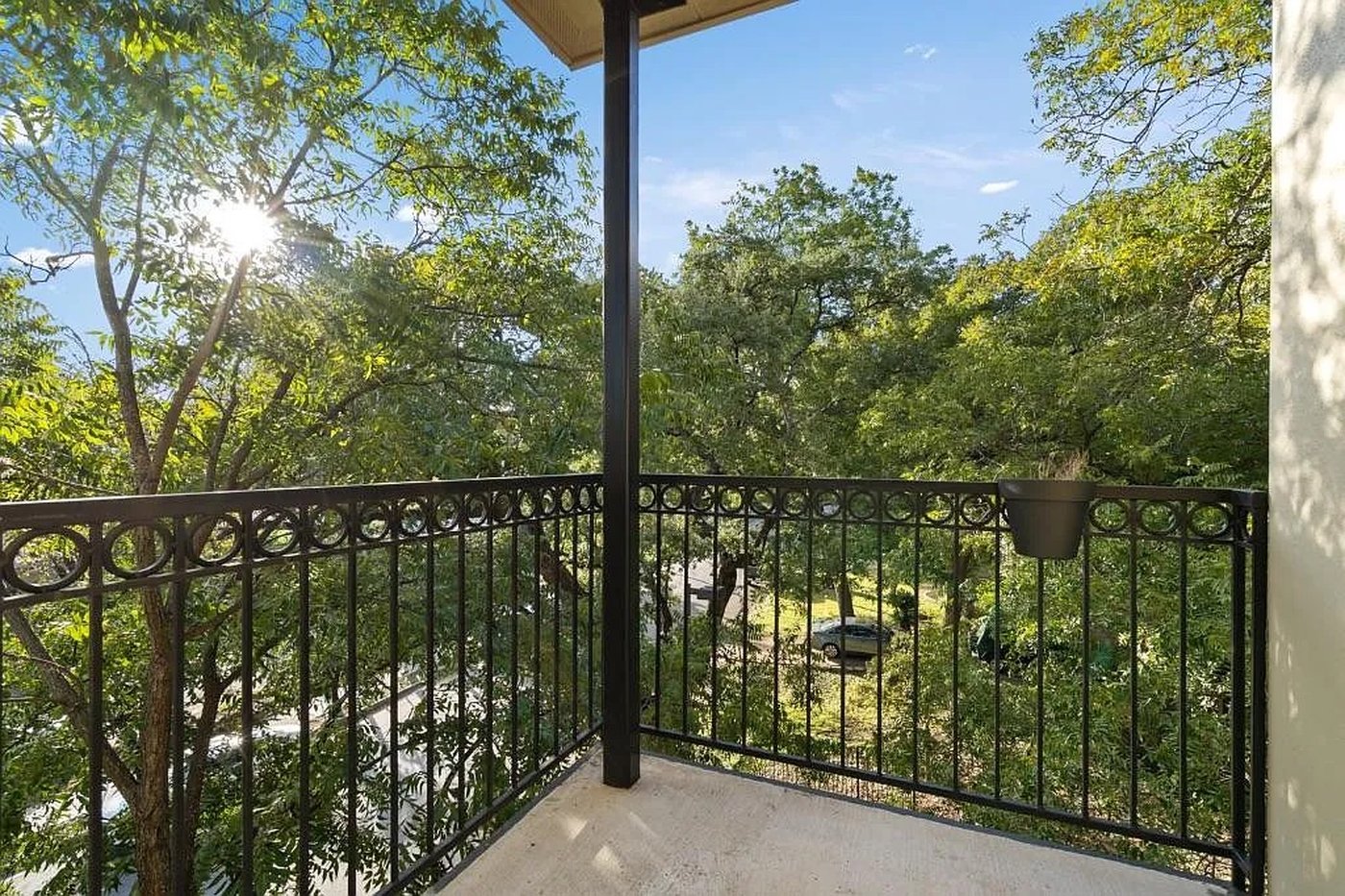 Private balcony overlooking the oak trees at 1310 S 1st St #310 Austin