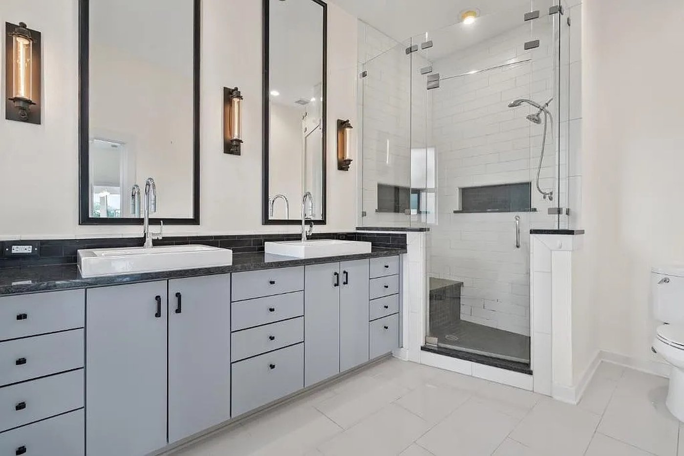 Primary bathroom with dual vanity and a massive walk in shower at 1310 S 1st St #310