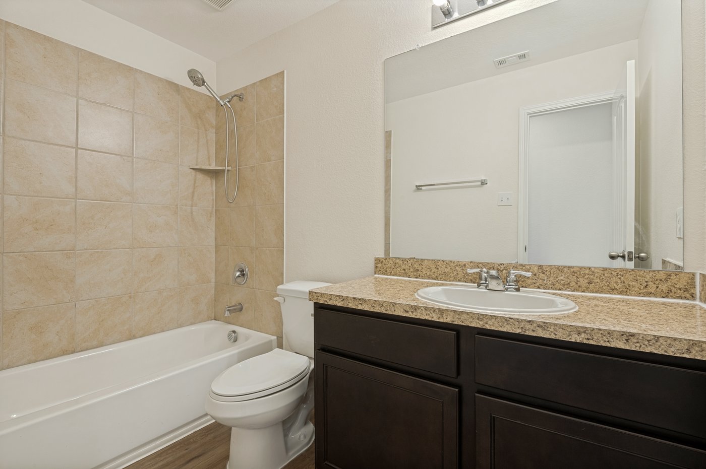 Second full bathroom with a tub shower combination at 1403 Kinglet Dr, Ennis, TX