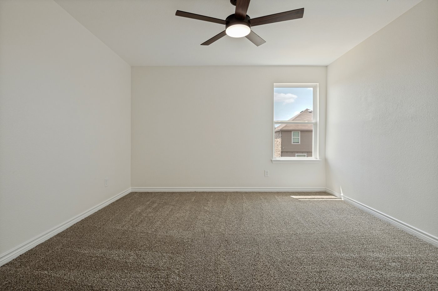 Fourth bedroom with carpet at 1403 Kinglet Dr, Ennis