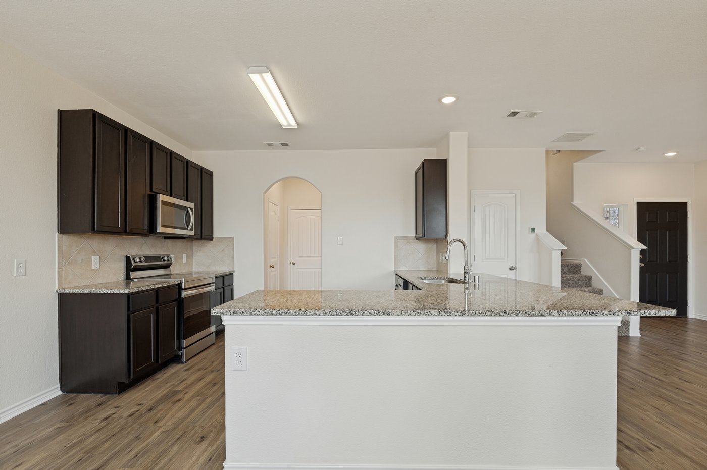Granite island in the kitchen at 1403 Kinglet Dr, Ennis, TX