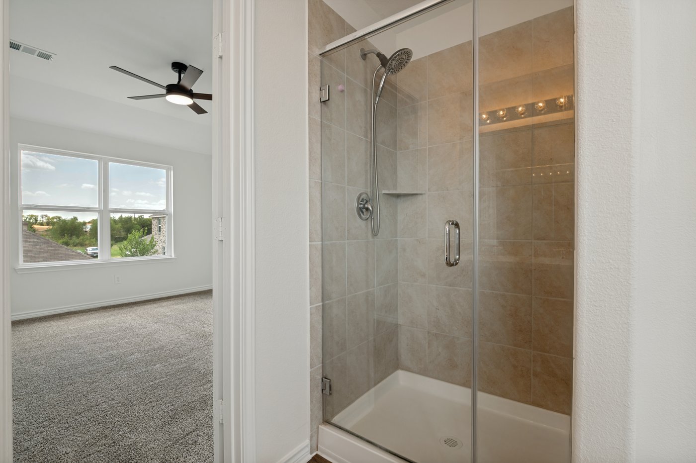 Primary bath with a separate walk in shower at 1403 Kinglet Dr, Ennis