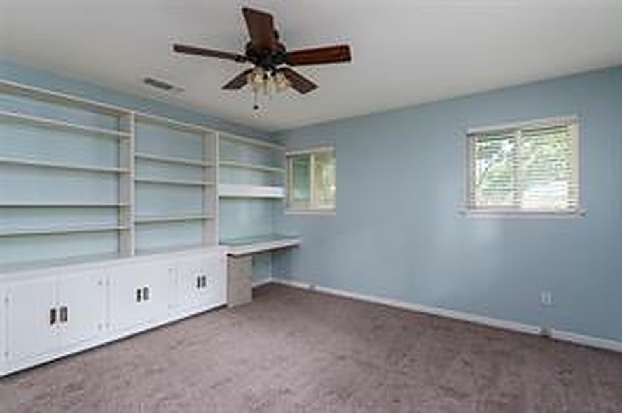 Room with built-in shelving at 1608 Freeman Ct, Arlington