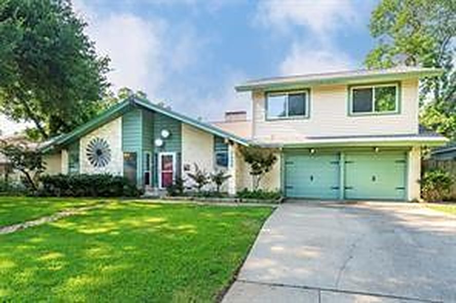 Front exterior of 1608 Freeman Ct, a two-story home with a two car garage for lease in Arlington, TX