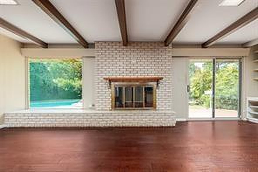 Living room with a brick wood-burning fireplace at 1608 Freeman Ct, Arlington