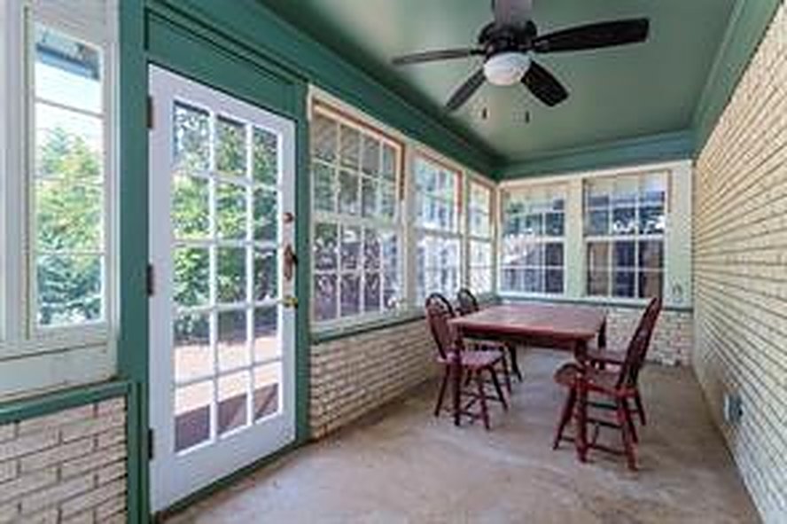 Bright sunroom with a ceiling fan at 1608 Freeman Ct, Arlington