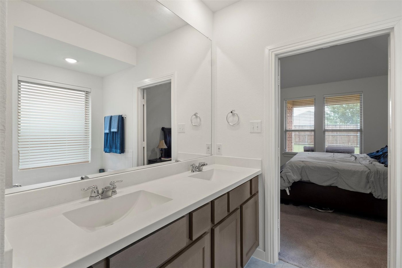 Upstairs full bathroom with dual vanities at 1848 Coronet Ave, Aubrey, TX