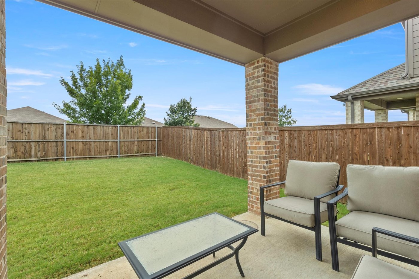 Covered back patio and outdoor living space at 1848 Coronet Ave, Aubrey