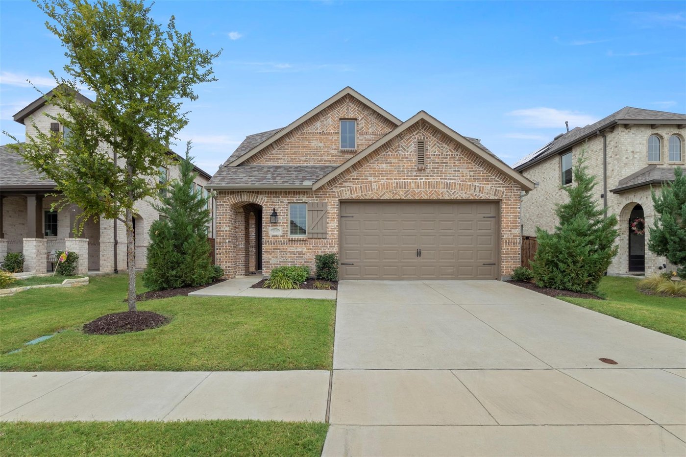 Front exterior of 1848 Coronet Ave, a 2021 Highland Homes brick home for sale in Aubrey, TX