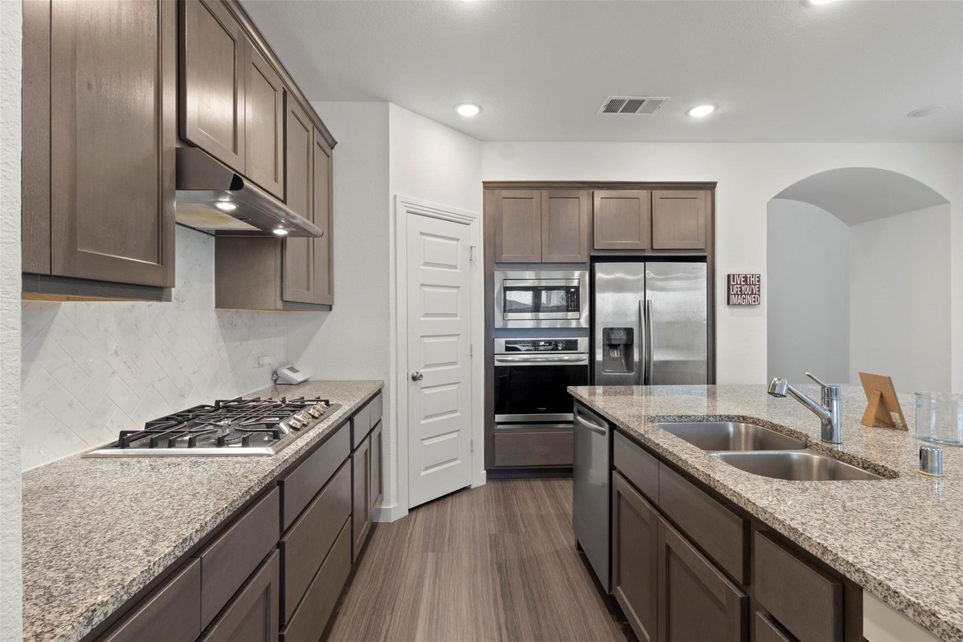 Kitchen with gas cooktop and granite counters at 1848 Coronet Ave, Aubrey, TX
