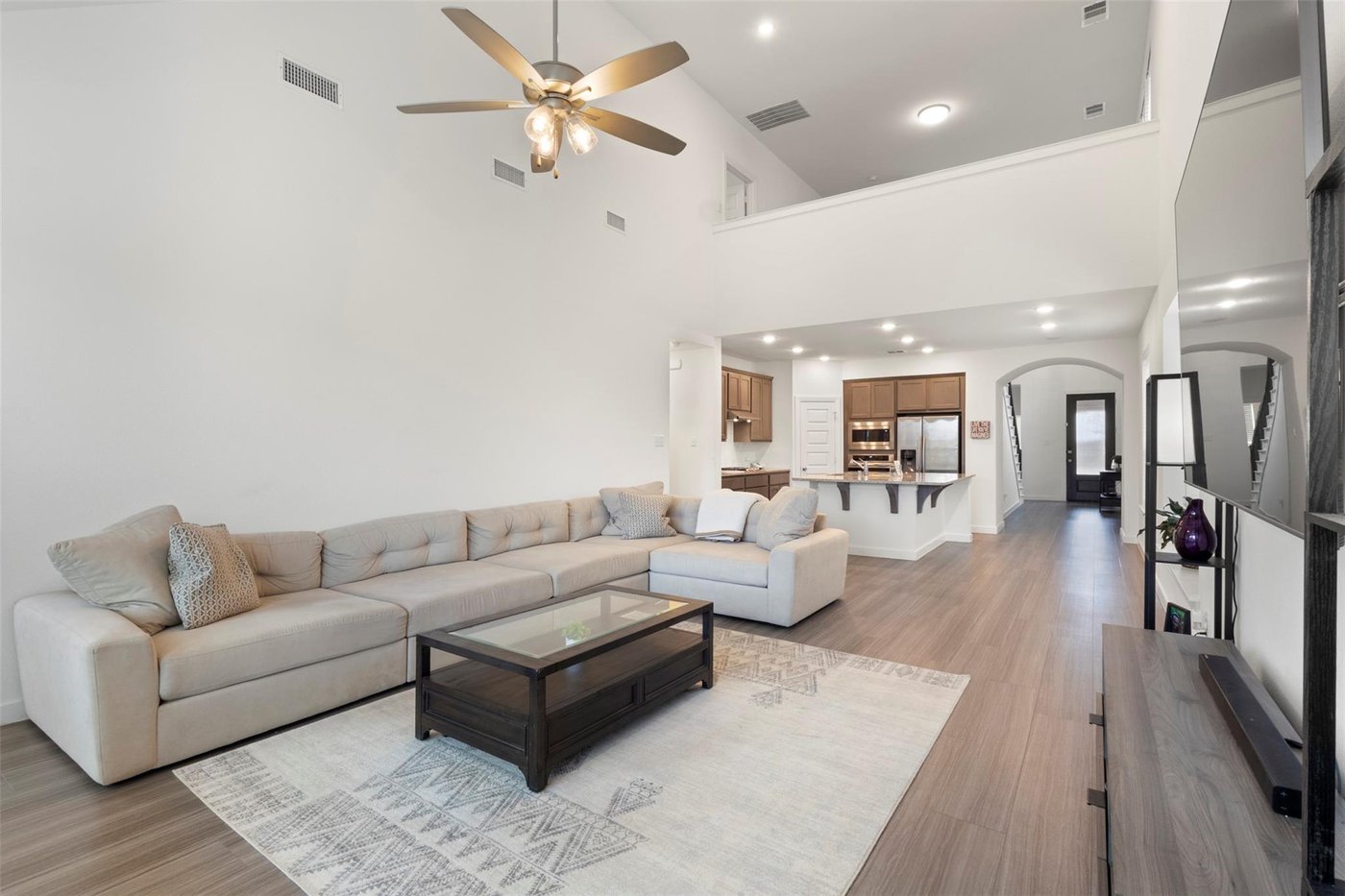Open living room with vaulted ceiling at 1848 Coronet Ave, Aubrey, TX