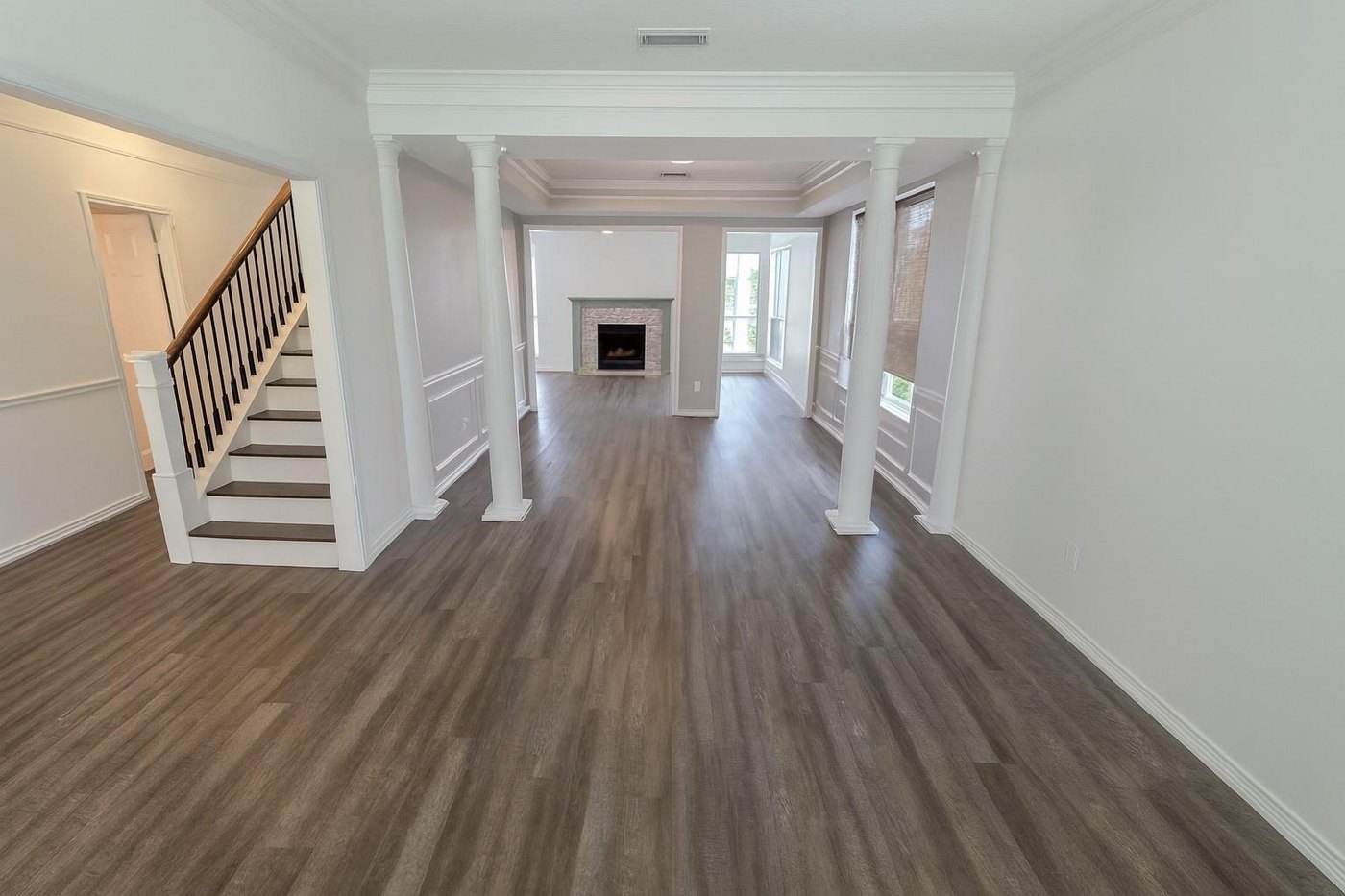 Entry and staircase with wood look flooring at 2009 Antwerp, Plano