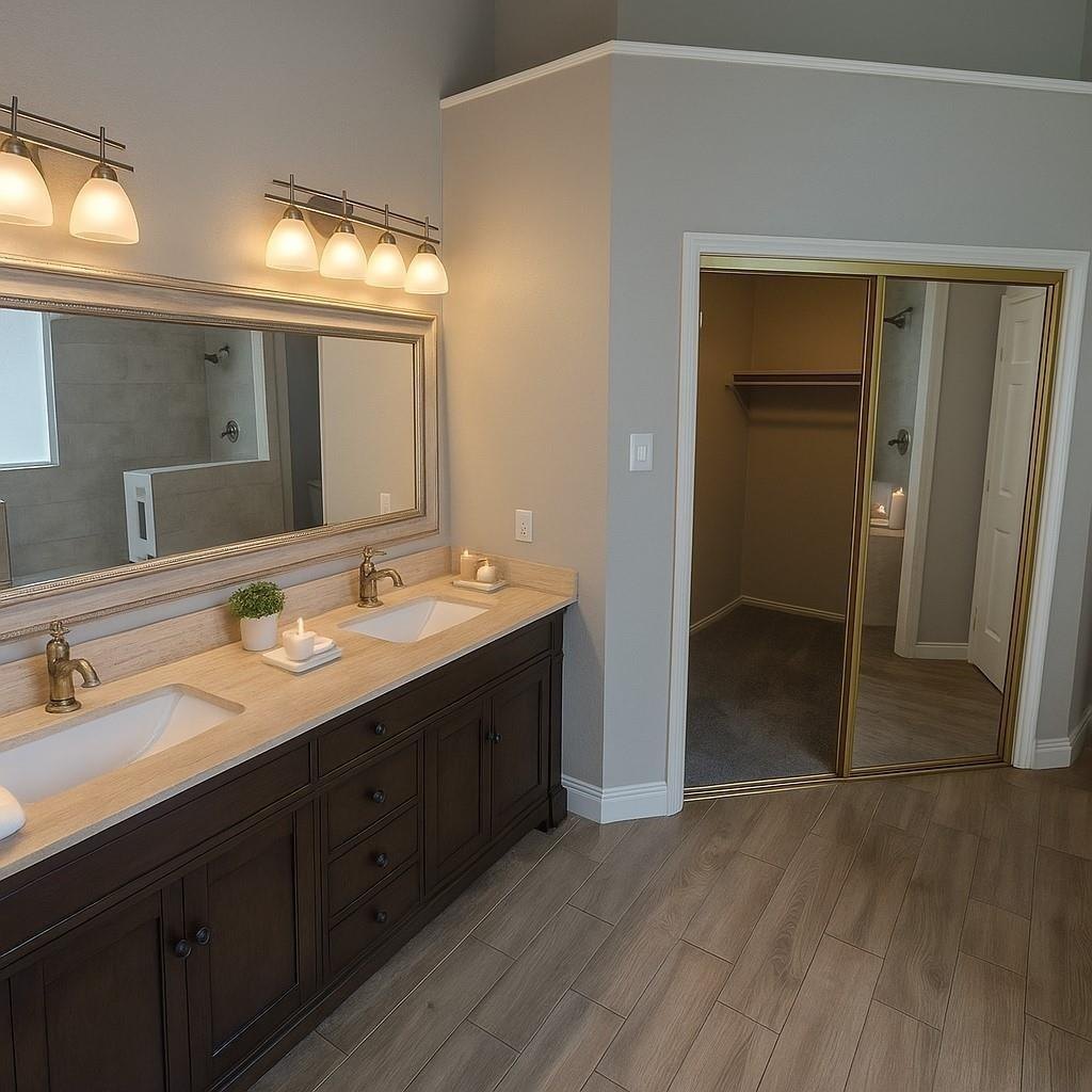 Primary bath with double vanities and a walk in closet at 2009 Antwerp, Plano