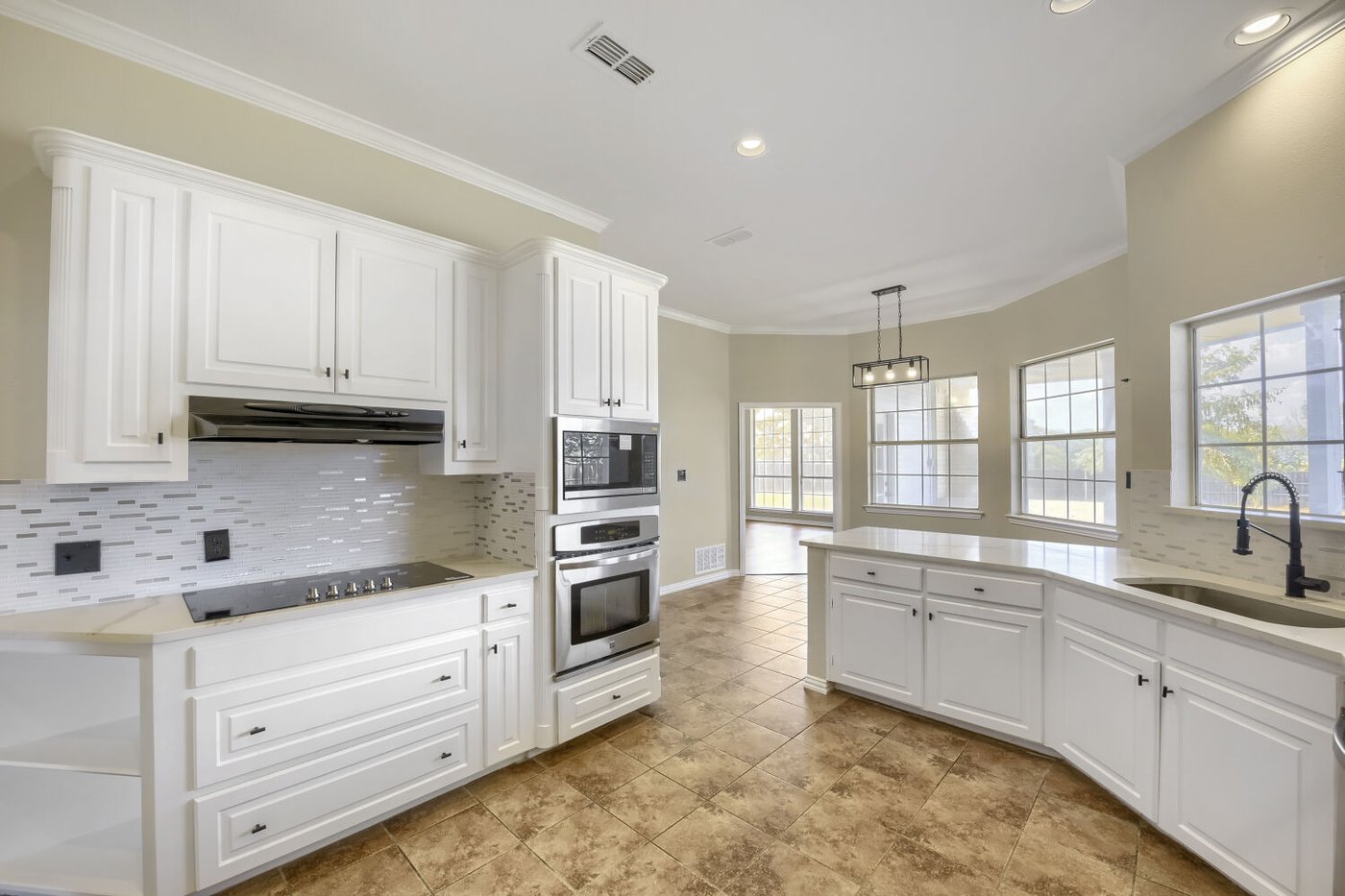 Kitchen with new countertops and backsplash at 201 N Garza Rd, Shady Shores, TX