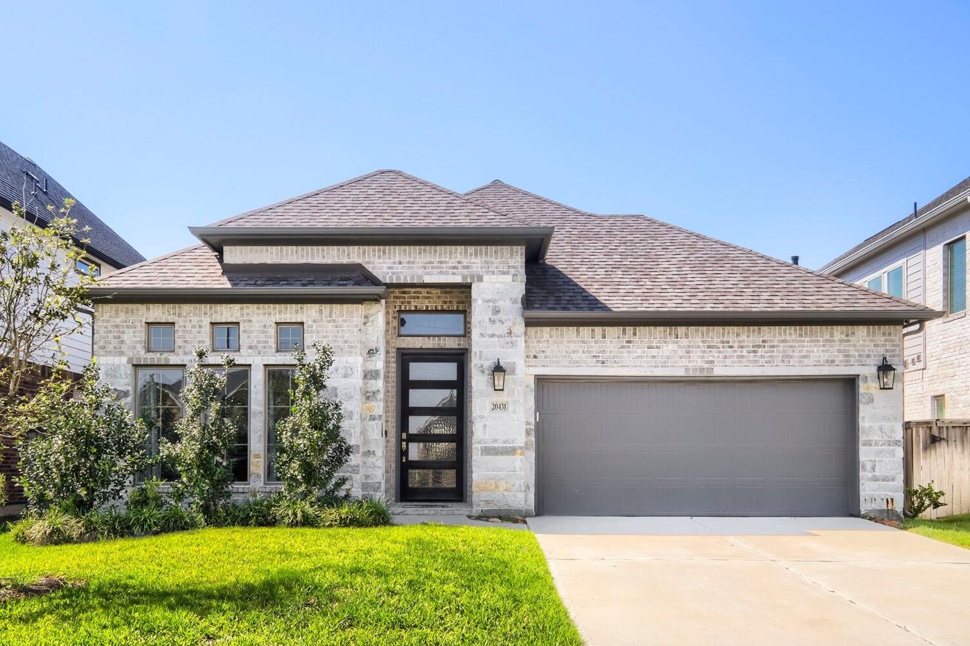 Front exterior of 20431 Yearling Pasture Ln, a one story home with a 2 car garage for lease in Tomball, TX