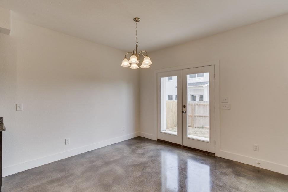 Dining area with stained concrete flooring at 206 Topaz, New Braunfels