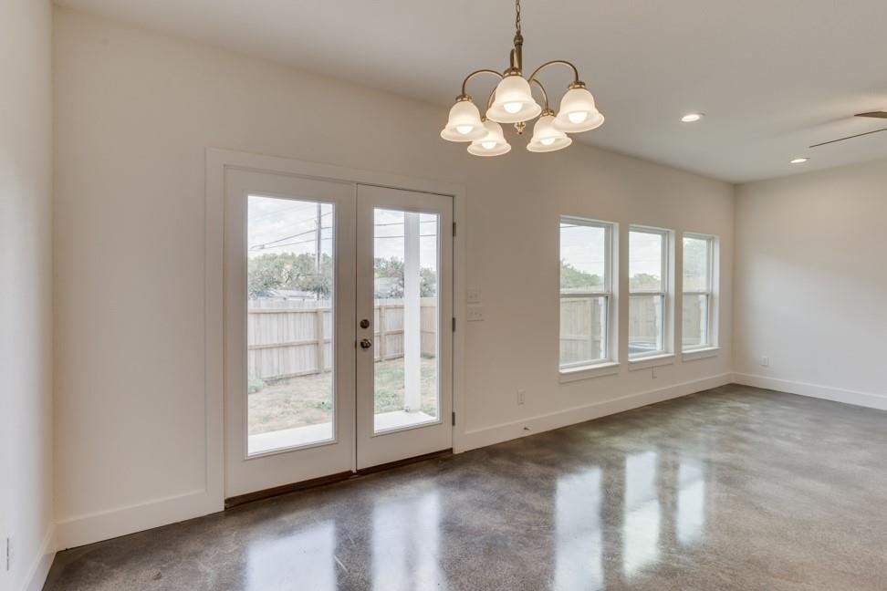 Living and dining area with backyard access at 206 Topaz in New Braunfels