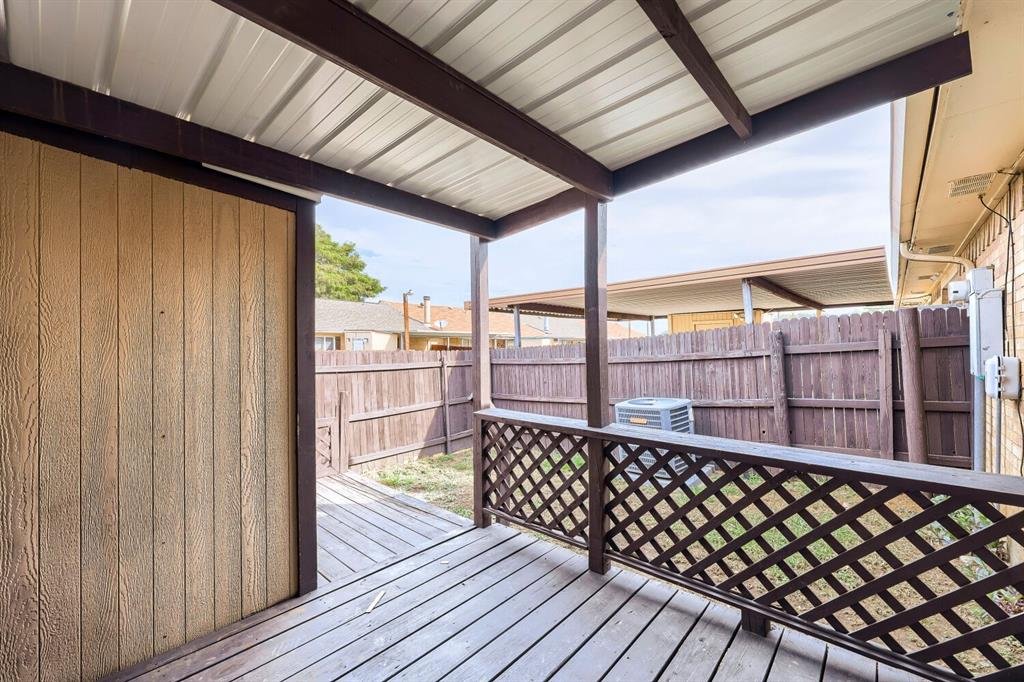 Covered wood deck in the backyard at 22 E Townhouse Ln #31, Grand Prairie