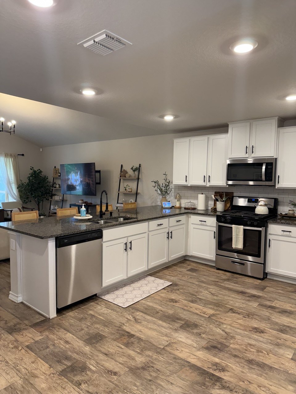 Kitchen with white shaker cabinets, dark granite counters, and stainless steel appliances at 22126 Backspin, San Antonio