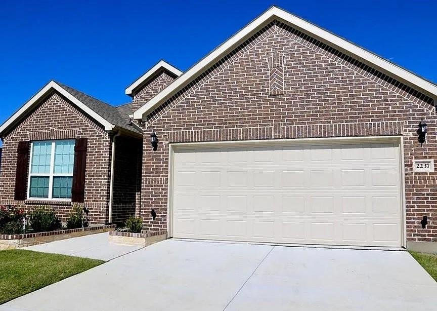 Front exterior of 2237 Candler Club Way, a two story home with a 2 car garage for lease in Little Elm, TX