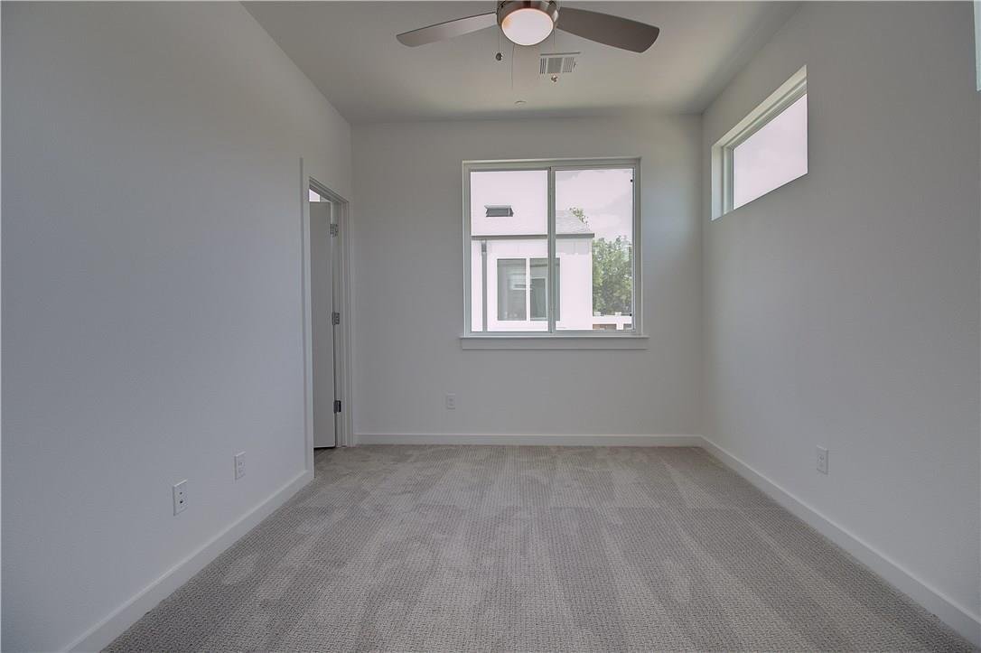 Second bedroom with Oak wood floors at 2310 N Carroll Ave Unit 105, Dallas