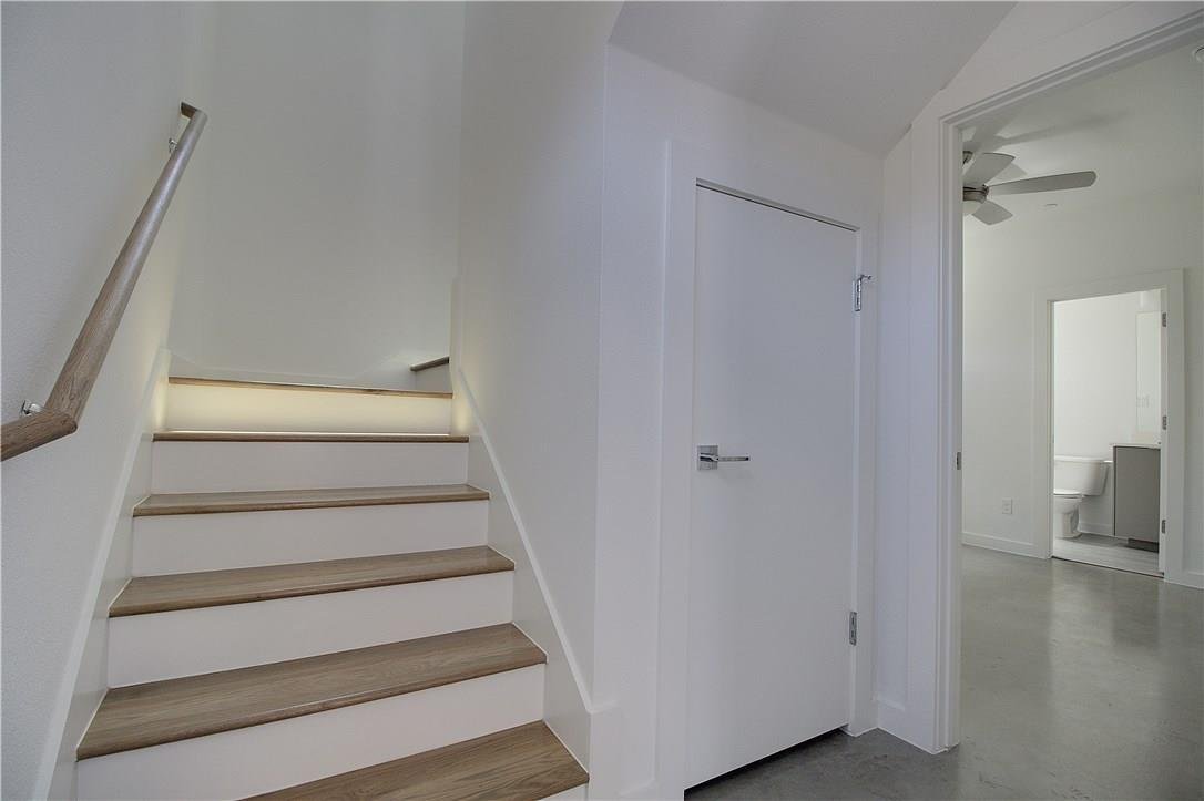 Modern staircase with LED lighting at 2310 N Carroll Ave Unit 105, Dallas