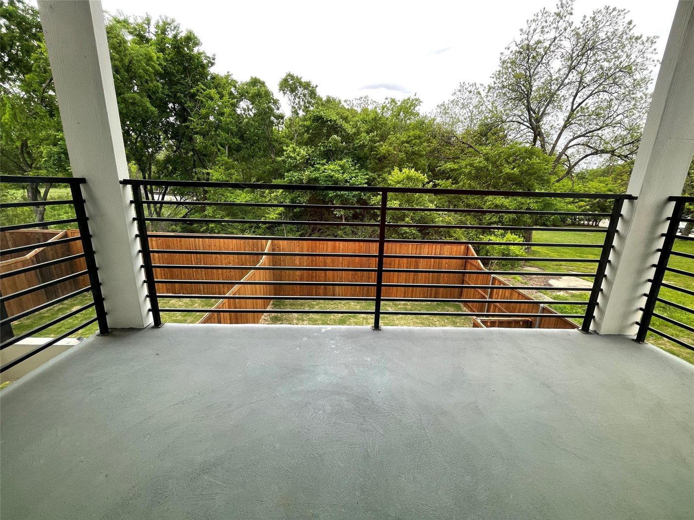 Covered patio and balcony with skyline views at 2417 N Winnetka Ave, Dallas