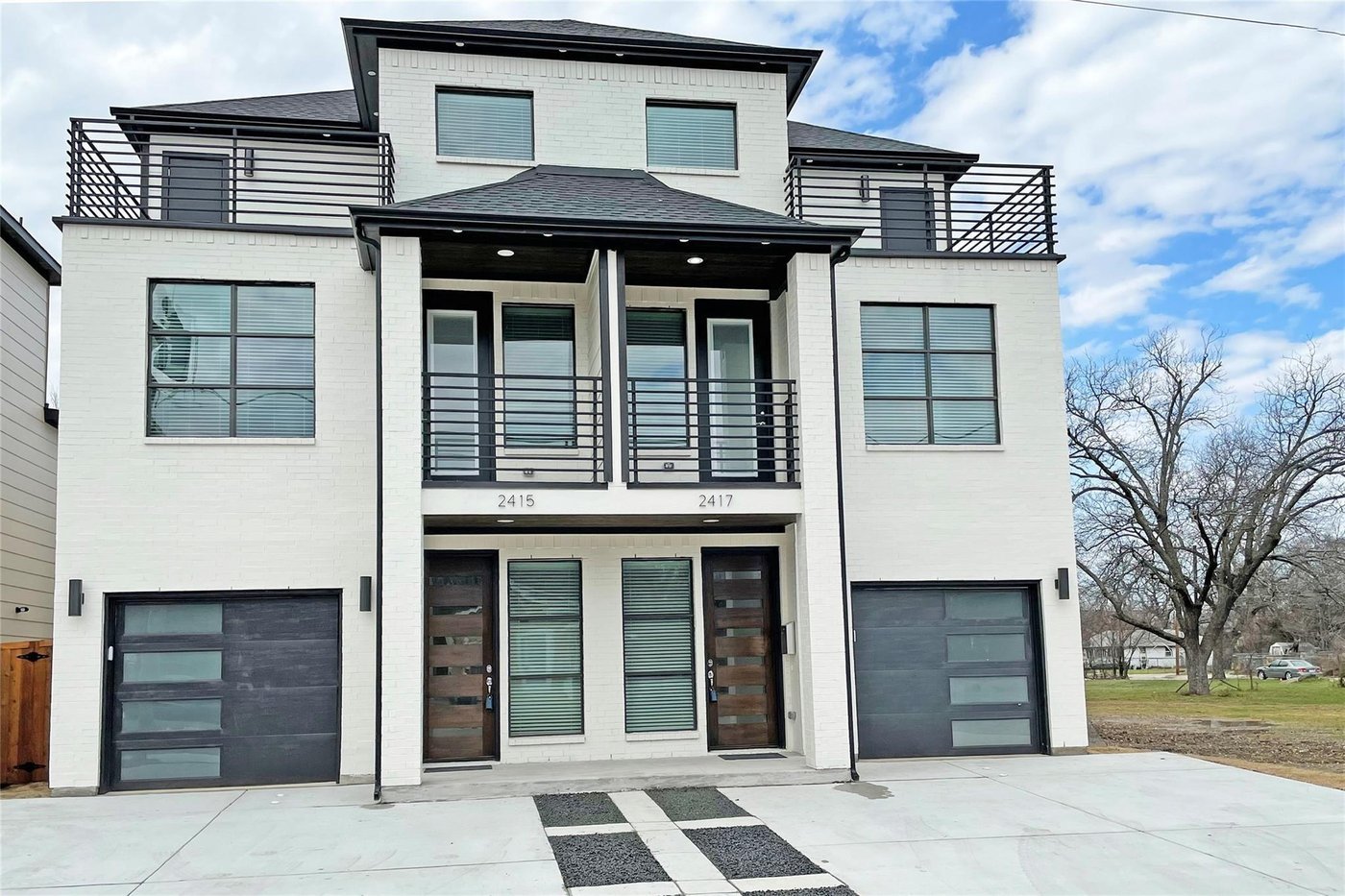 Front exterior of 2417 N Winnetka Ave, a 2021 built contemporary duplex for lease in Dallas, TX