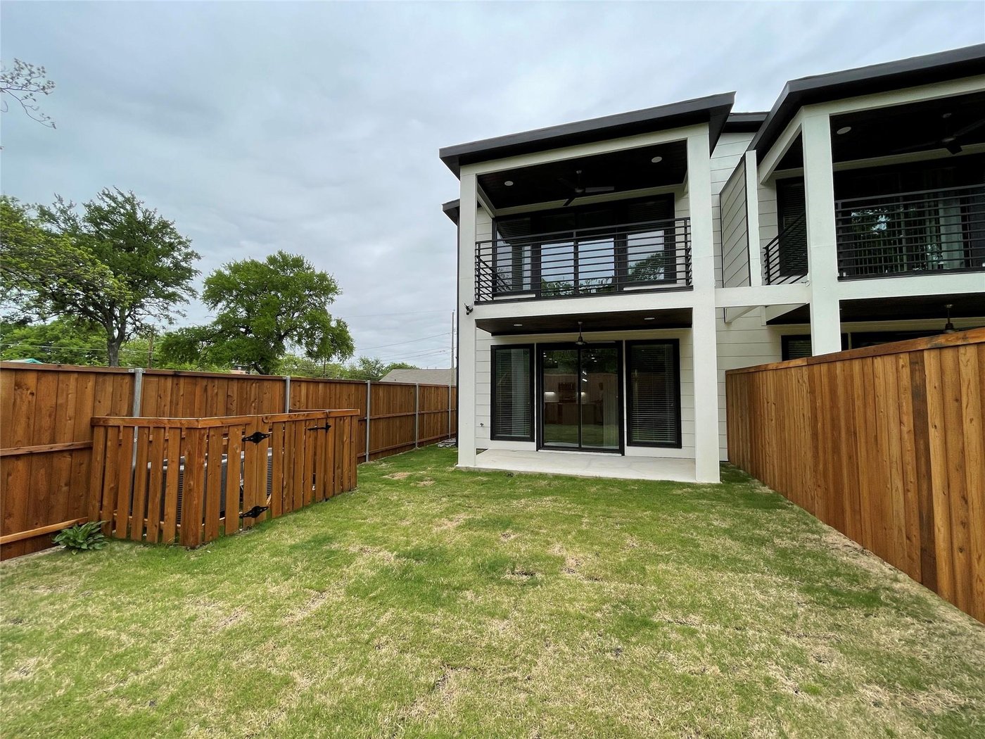 Rear exterior with balconies at 2417 N Winnetka Ave, Dallas