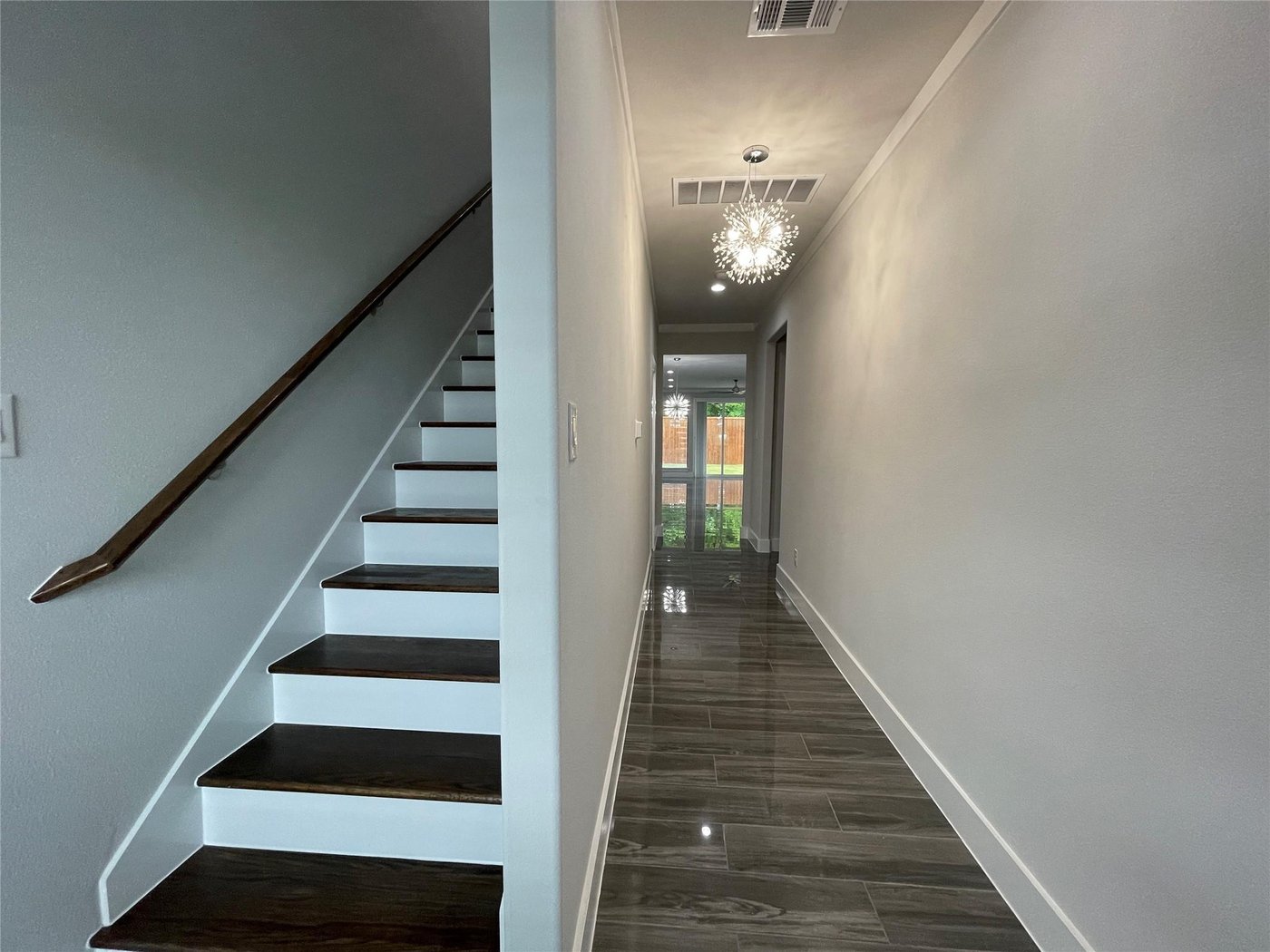 Modern staircase and hallway at 2417 N Winnetka Ave, Dallas