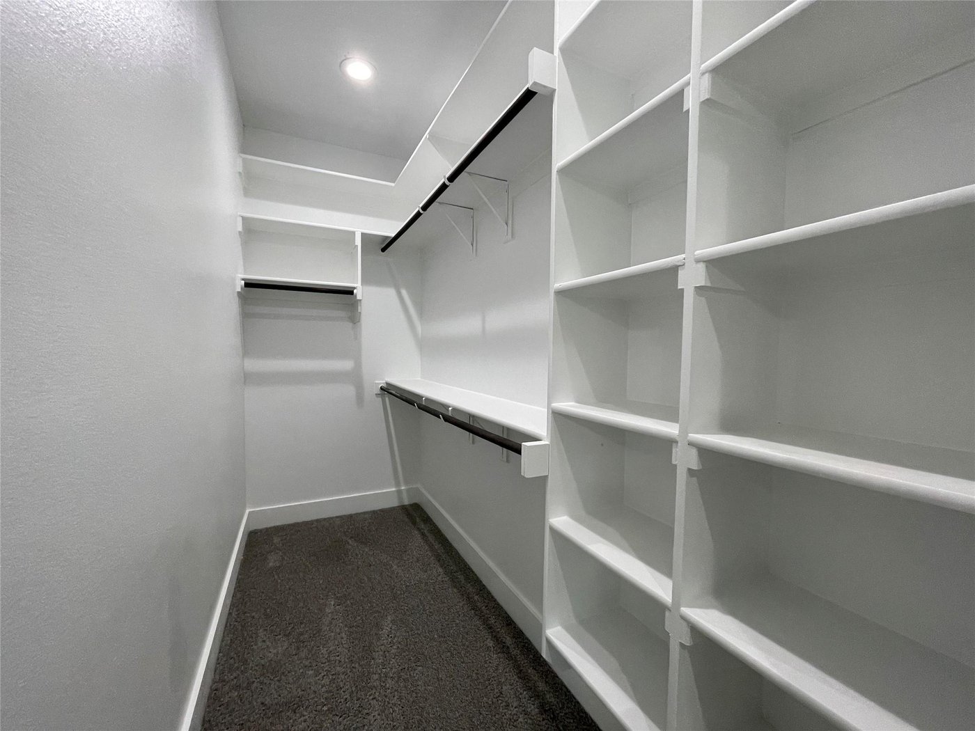 Large walk in closet with built in shelving at 2417 N Winnetka Ave, Dallas