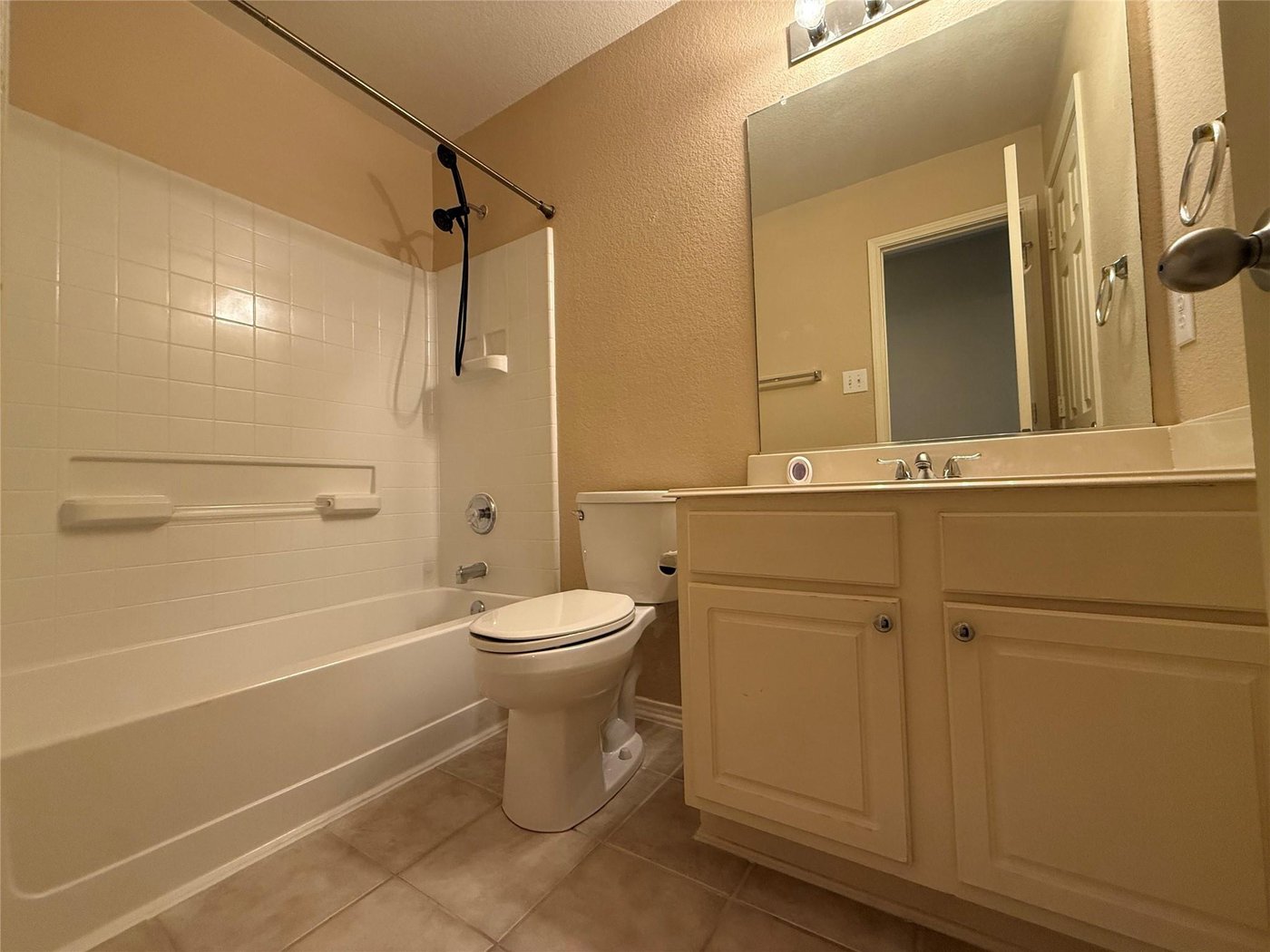 Second full bathroom with a tub shower combination at 3605 Cottonwood Rd