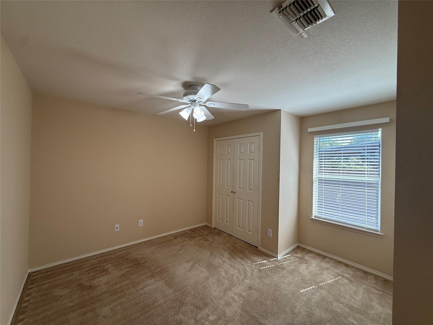 Second bedroom with carpet and ceiling fan at 3605 Cottonwood Rd, Melissa