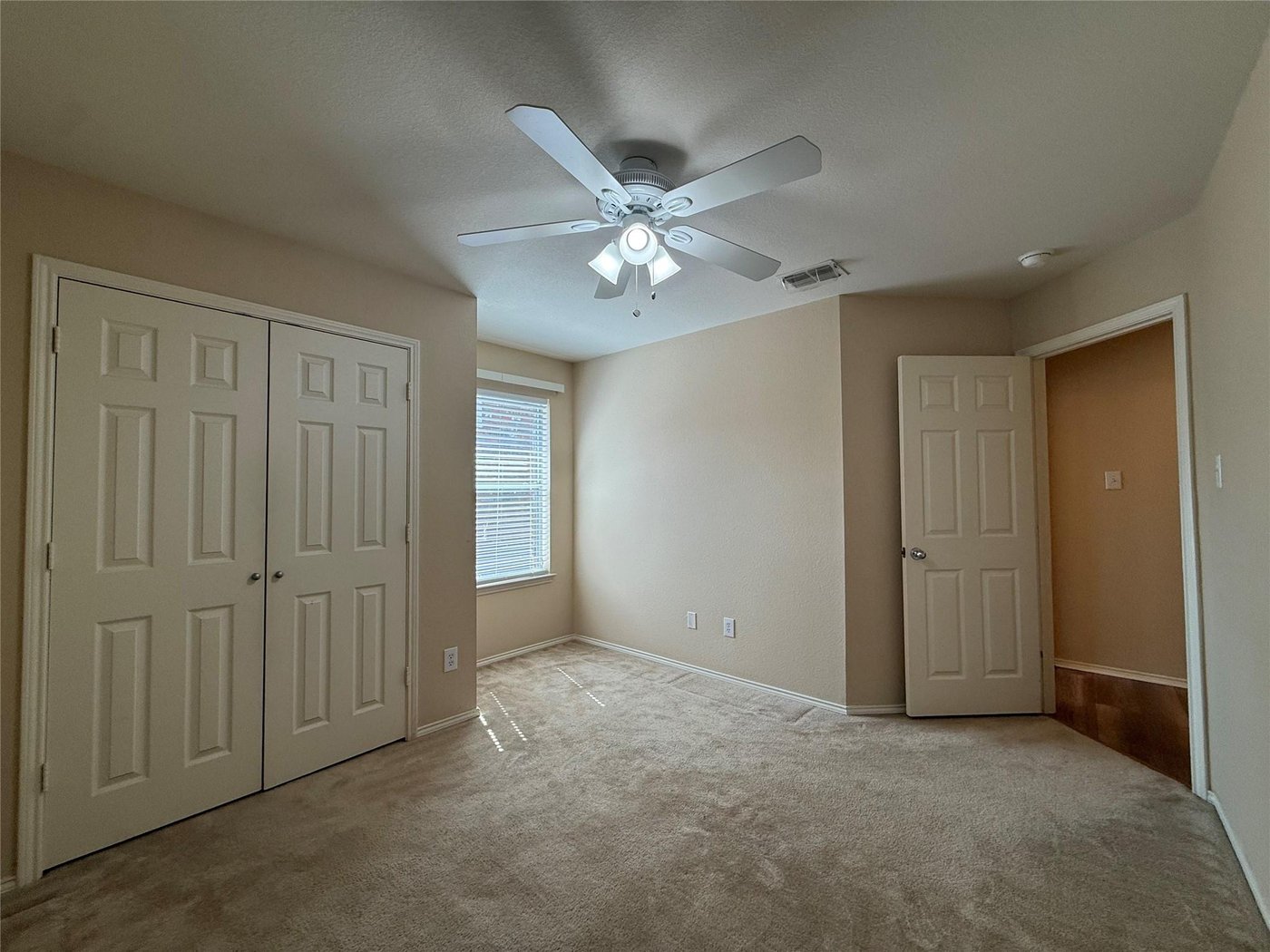 Third bedroom with a window and ceiling fan at 3605 Cottonwood Rd, Melissa