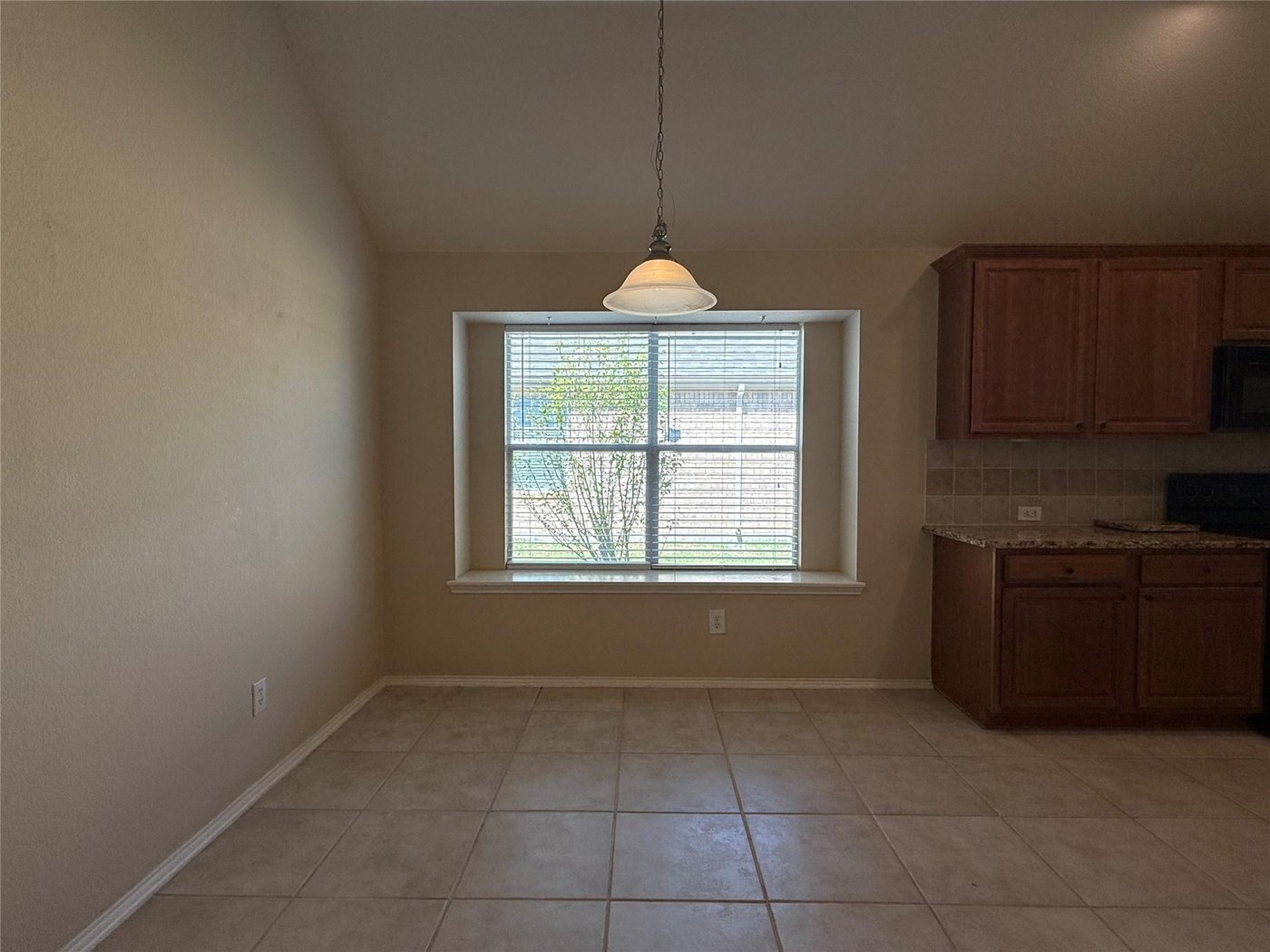 Breakfast nook with a bright window off the kitchen at 3605 Cottonwood Rd