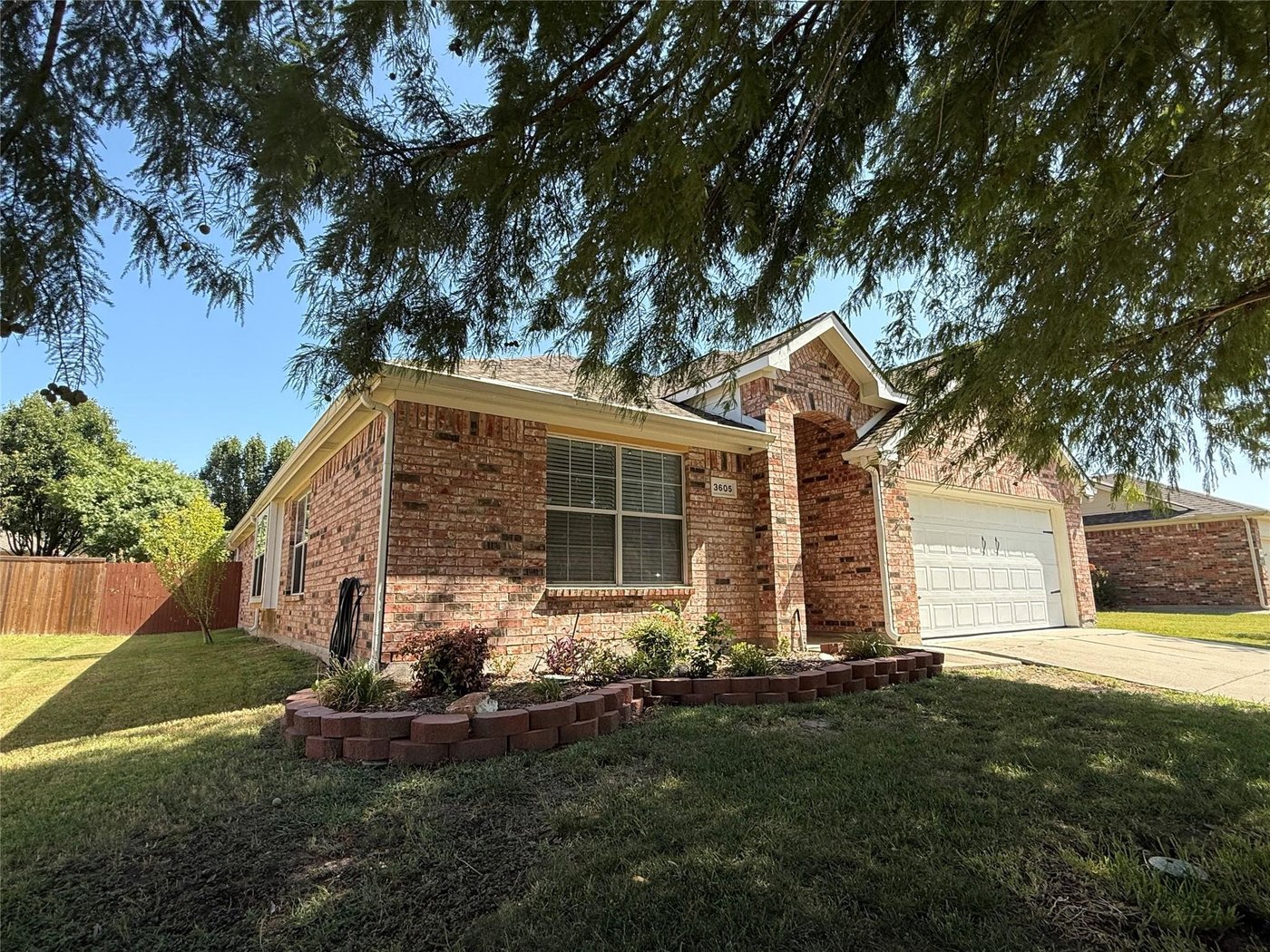 Angled front view of 3605 Cottonwood Rd with a two car garage in Melissa, TX