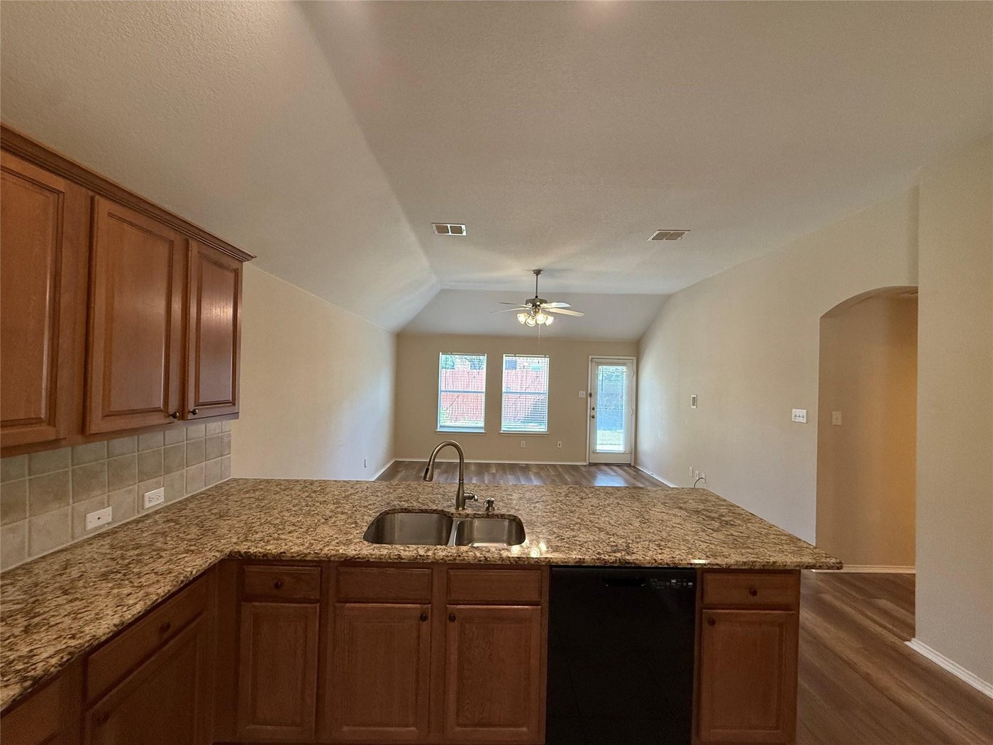 Kitchen with granite countertops and breakfast bar at 3605 Cottonwood Rd, Melissa