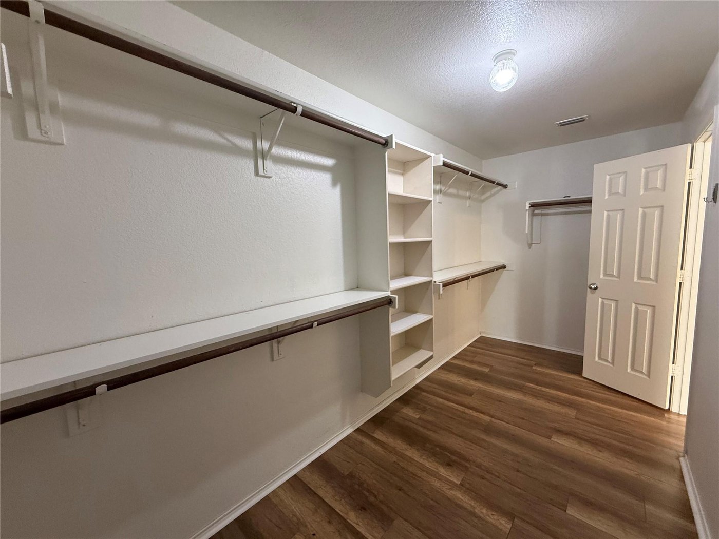 Large walk in closet in the primary suite at 3605 Cottonwood Rd, Melissa