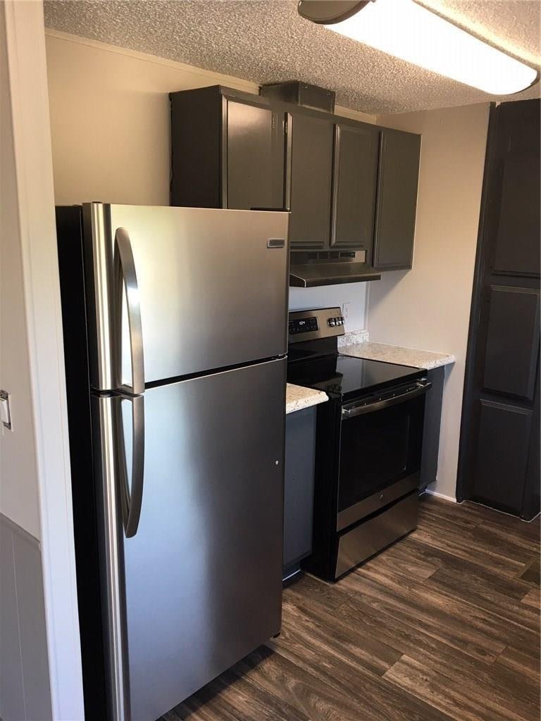 Kitchen with a stainless refrigerator and electric range at 365 Darrell Rd, Roanoke