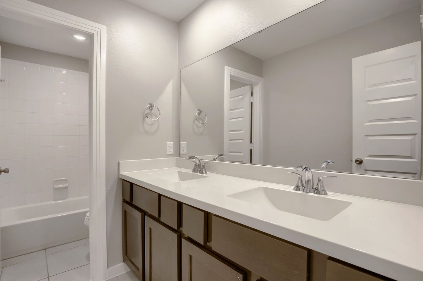 Additional full bathroom with a dual sink vanity at 3925 Chesapeake Ln