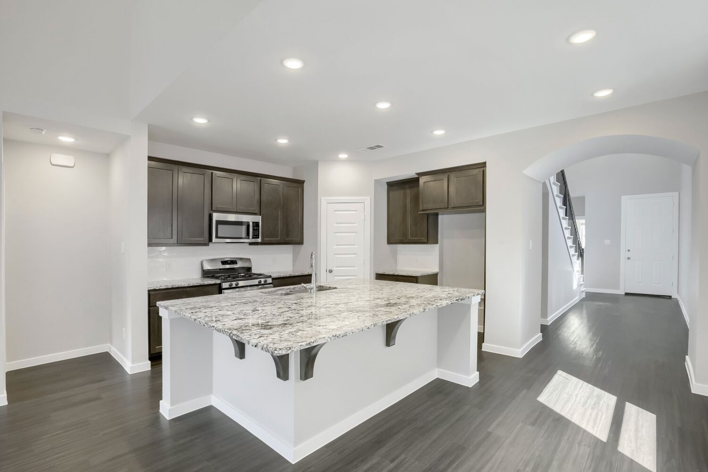 Kitchen island with double sink and seating at 3925 Chesapeake Ln, Heartland