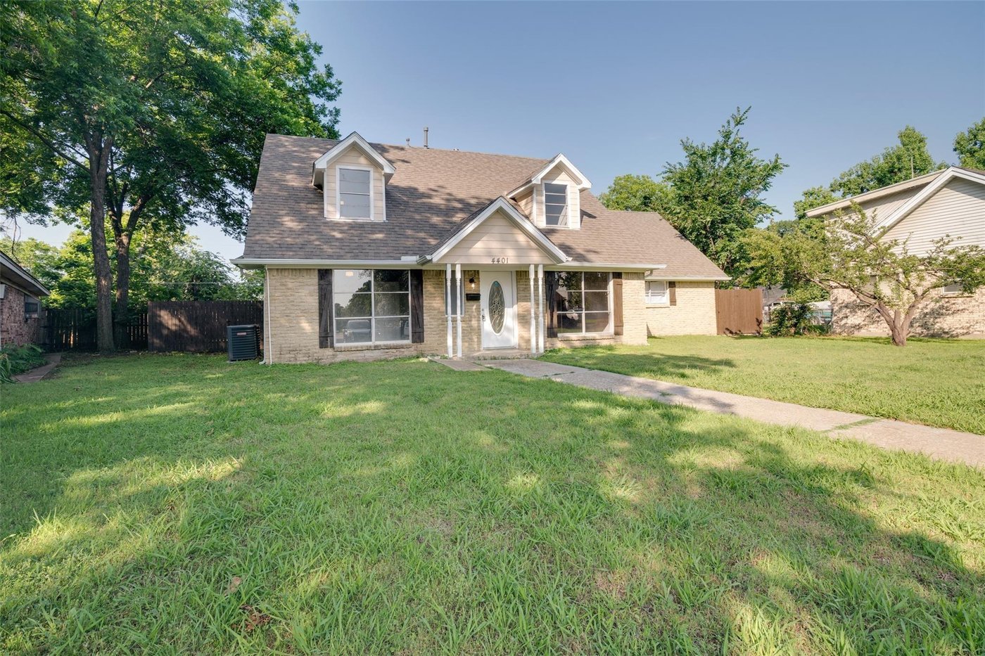 Front exterior of 4401 Ivy Dr, an updated home on a tree filled lot in Mesquite, TX