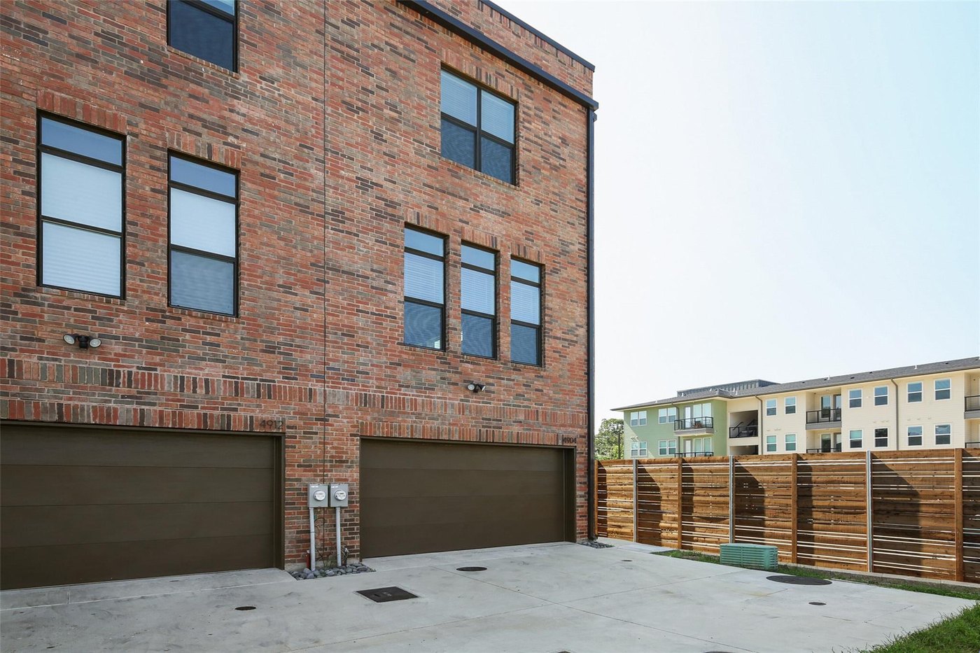 Rear exterior with attached garages at 4904 Lexington Ct, Dallas