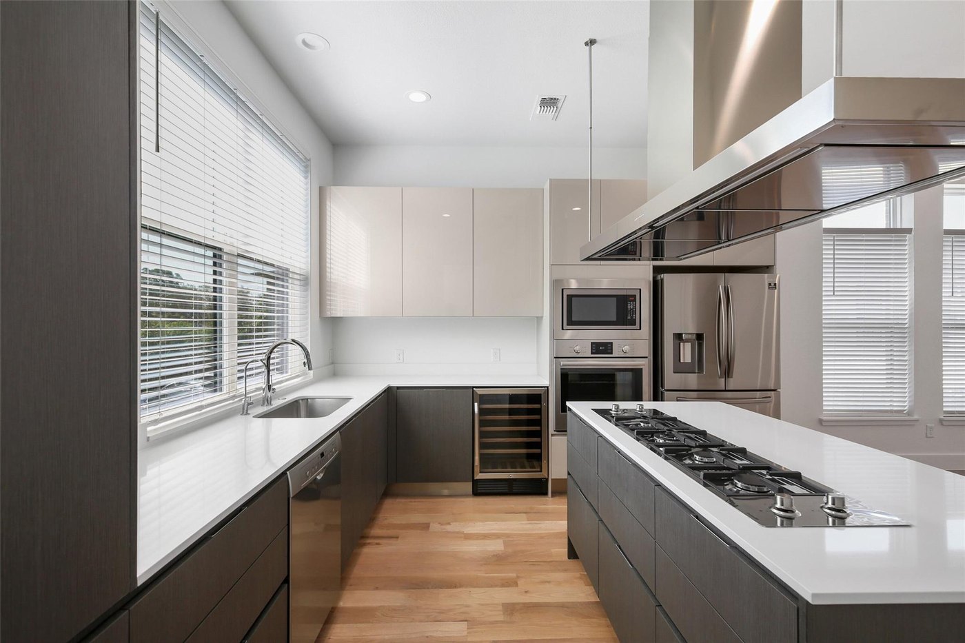 Kitchen with a gas cooktop and built in wine fridge at 4904 Lexington Ct, Dallas